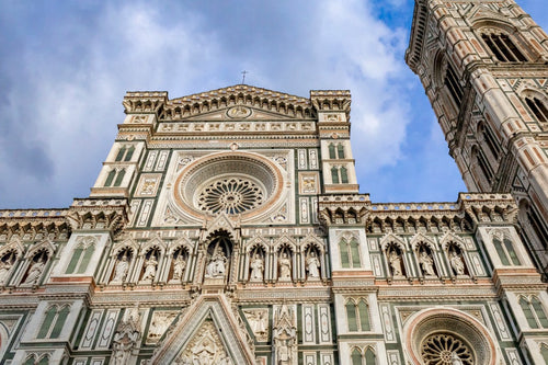 Large cathedral with a tall bell tower against a blue sky